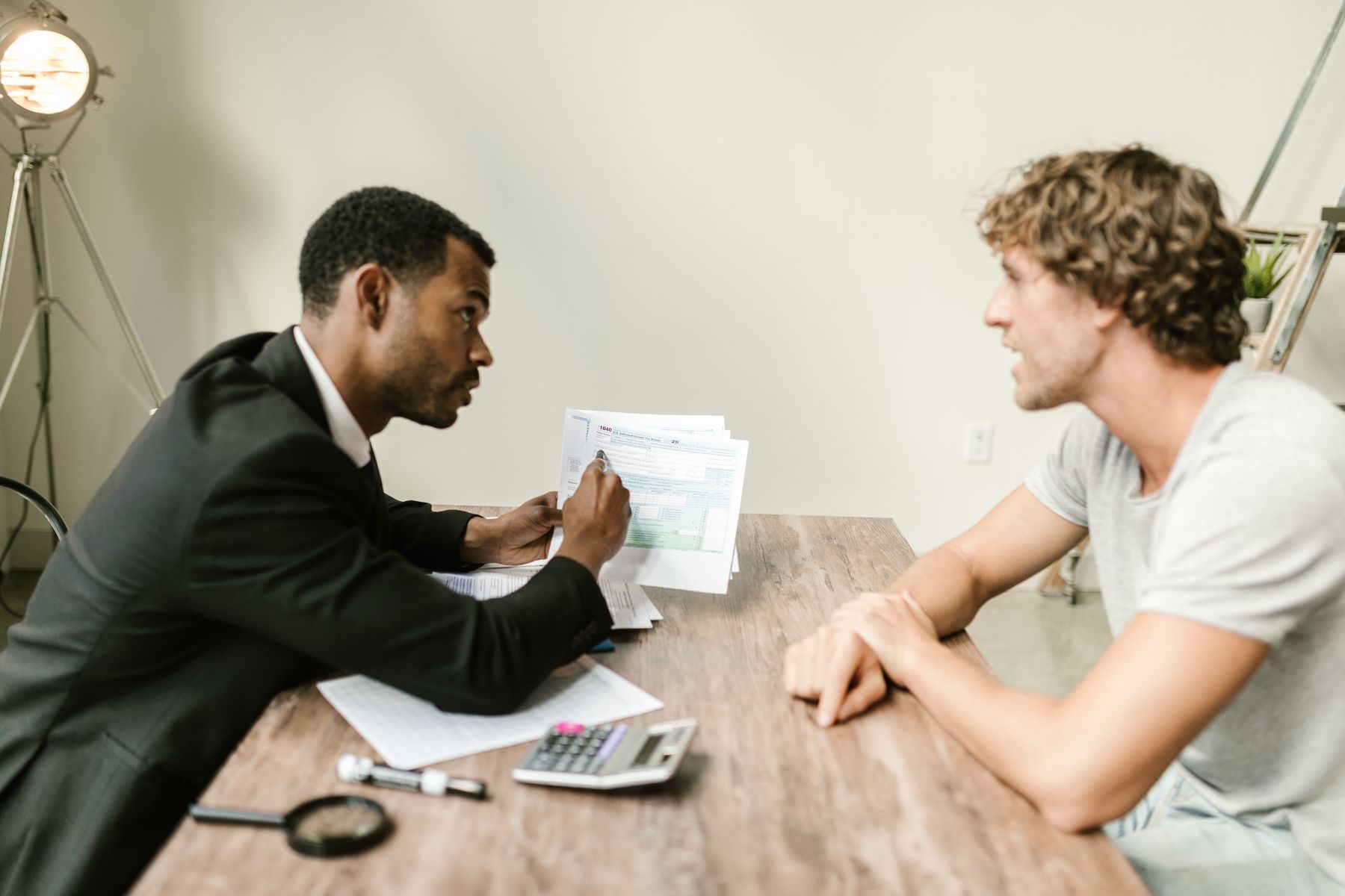 An advisor walking a client through his documents