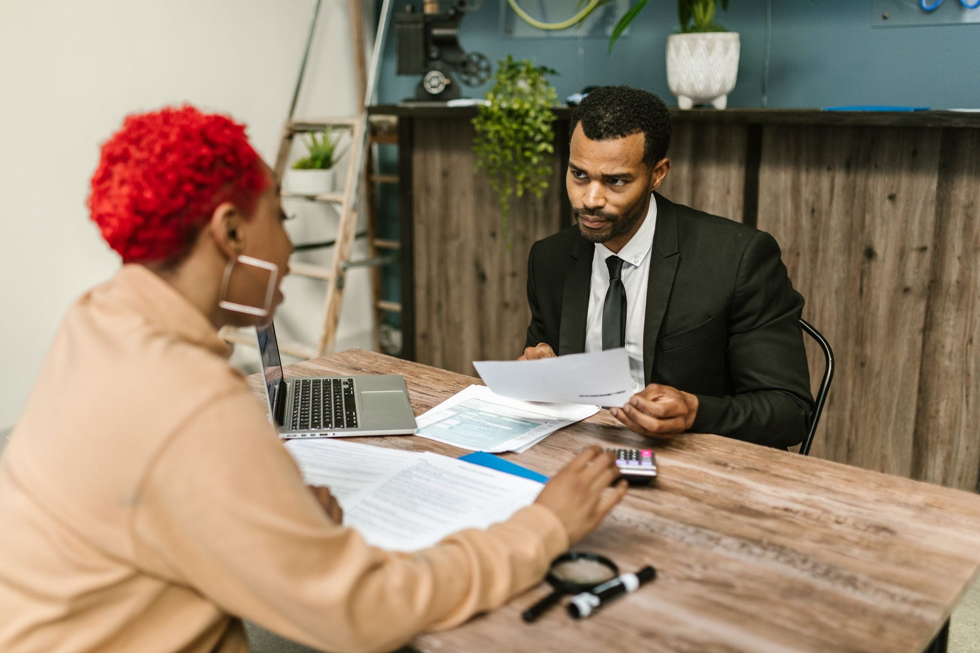 An advisor reviewing tax documents with a client
